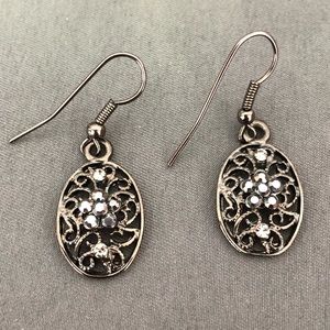 Silver. Jeweled flower oval earrings.